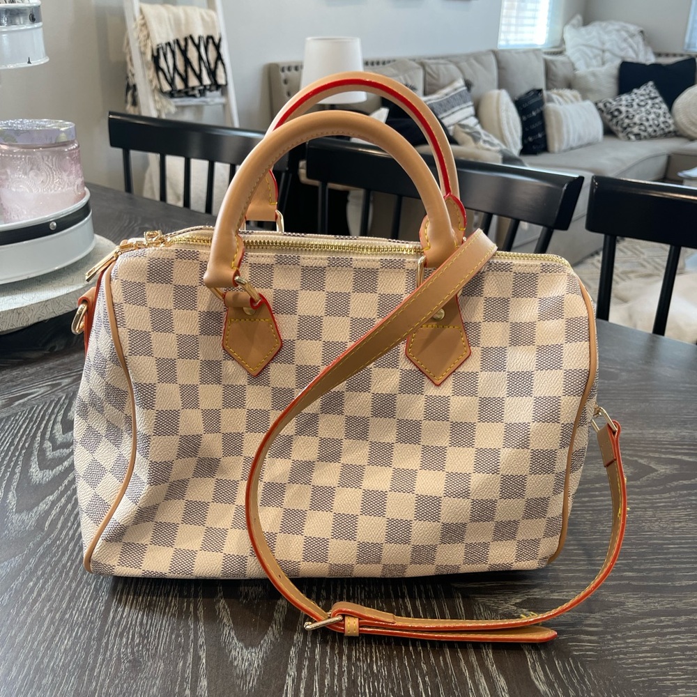 White checkered handbag with tan and red details